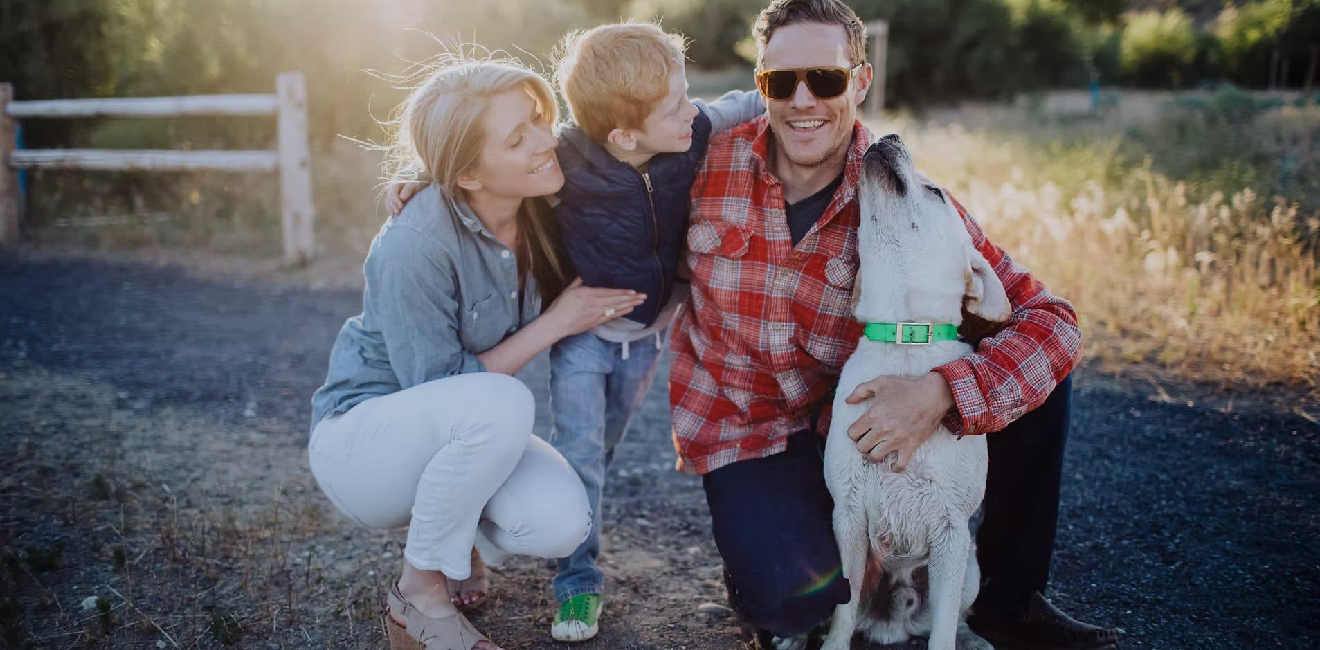 Happy family with child and dog at their new home