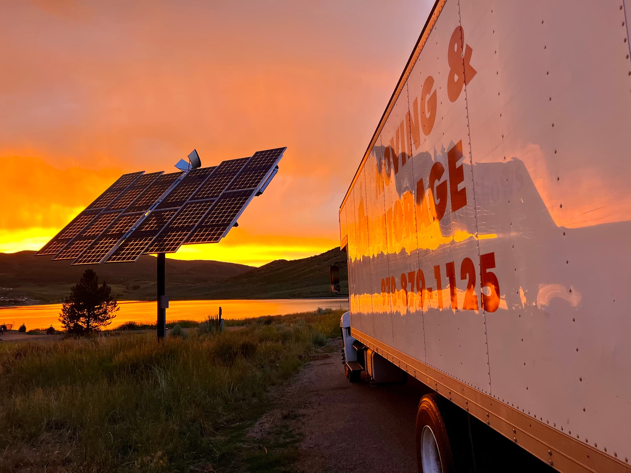 Conroy Moving truck at Stagecoach Reservoir with solar panels during sunset